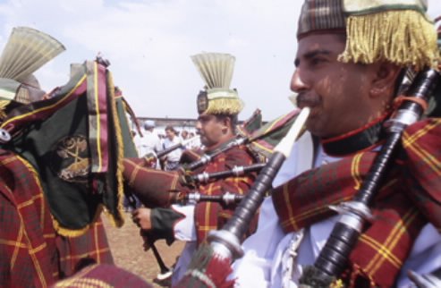 img2 Pakistani troops in kilts play the bagpipes in a marching band attached to MONUC 'peacekeeping' operations in South Kivu, DRC. Photo copyright Keith Harmon Snow, July 2005.