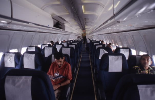 img6 In Congo they call it MONUC AIR. Seen here is a jetliner leased by MONUC on a flight from Bujumbura, Burundi to Kinshasa, Congo's capital city, filled to about 10% capacity. Photo Keith Harmon Snow, 2005.