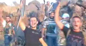 Rebel fighters celebrate either on July 14 or May 25.