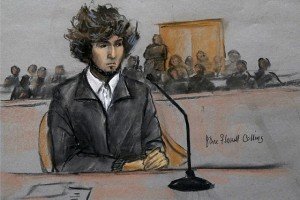 In this courtroom sketch, Boston Marathon bombing suspect Dzhokhar Tsarnaev is depicted sitting in federal court in Boston Thursday, Dec. 18, 2014, for a final hearing before his trial begins in January. Tsarnaev is charged with the April 2013 attack that killed three people and injured more than 260. He could face the death penalty if convicted. (AP Photo/Jane Flavell Collins)