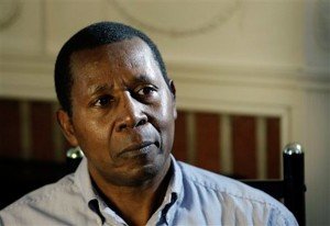 Rwandan professor Leopold Munyakazi listens to a question during an interview, Thursday, Feb. 5, 2009 at his home in Towson, Md. Munyakazi, who taught French at Goucher College, was recently removed from teaching after the school became aware he was wanted in his home country on genocide charges. The U.S. Immigration and Customs Enforcement agency says it arrested Munyakazi today for being in the United States illegally. (AP Photo/Rob Carr)